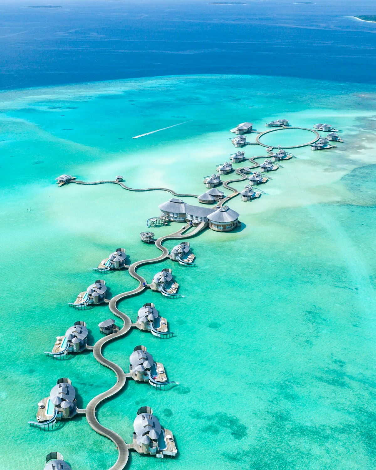 Overwater bungalows in the Maldives with turquoise lagoon